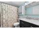 Bathroom features decorative shower curtain, white vanity with marble top, and vanity lights at 12920 N Oakhaven Dr, Camby, IN 46113