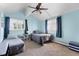Bright bedroom featuring two twin beds, a ceiling fan, and ample natural light at 12920 N Oakhaven Dr, Camby, IN 46113