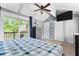 Bedroom features a ceiling fan, carpeting, patio doors to deck, TV and built-in closets at 12920 N Oakhaven Dr, Camby, IN 46113