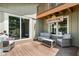 Inviting outdoor deck with comfortable seating and organic sign, perfect for relaxing and entertaining guests at 12920 N Oakhaven Dr, Camby, IN 46113