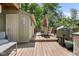 Spacious wooden deck with dining area and grill, ideal for outdoor cooking and enjoying the fresh air at 12920 N Oakhaven Dr, Camby, IN 46113