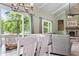 Bright dining area flows into living space with large windows and lots of natural light at 12920 N Oakhaven Dr, Camby, IN 46113