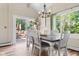 Charming dining area with wood floors, a rustic table, and a view to the outdoors at 12920 N Oakhaven Dr, Camby, IN 46113