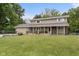 Two-story home with a well-manicured lawn and mature trees, providing a serene and inviting outdoor space at 12920 N Oakhaven Dr, Camby, IN 46113