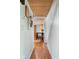 Hallway with wood flooring and wood ceiling with a view into the kitchen at 12920 N Oakhaven Dr, Camby, IN 46113