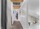 Hallway with carpet, wood ceiling, white railing, and natural light leads to bedrooms and other spaces at 12920 N Oakhaven Dr, Camby, IN 46113