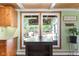 Eat-in kitchen features wood floors, cabinets, natural light, view of outdoor living space at 12920 N Oakhaven Dr, Camby, IN 46113