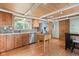 Kitchen featuring wood cabinets, stainless steel appliances, and hardwood floors at 12920 N Oakhaven Dr, Camby, IN 46113