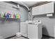 Well-equipped laundry room with a washer, dryer, and shelving for storage at 12920 N Oakhaven Dr, Camby, IN 46113