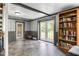 Spacious living room with a bookshelf and access to the backyard at 12920 N Oakhaven Dr, Camby, IN 46113