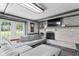 Comfortable living room with a fireplace and a large gray sectional sofa at 12920 N Oakhaven Dr, Camby, IN 46113