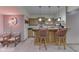 Basement kitchenette featuring a bar, cozy seating, and modern appliances at 1344 S Fox Paw Dr, New Palestine, IN 46163