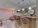 Basement bar area featuring barstools, a neon sign, and wood trim at 1344 S Fox Paw Dr, New Palestine, IN 46163