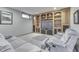 Finished basement with a built-in entertainment center and comfortable seating at 1344 S Fox Paw Dr, New Palestine, IN 46163