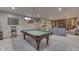 Finished basement with a pool table and a built-in entertainment center at 1344 S Fox Paw Dr, New Palestine, IN 46163