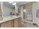 Bathroom featuring a single vanity, a large mirror and a glass-enclosed shower at 1344 S Fox Paw Dr, New Palestine, IN 46163
