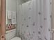 Cozy bathroom featuring butterfly shower curtain and decorative wall decor at 1344 S Fox Paw Dr, New Palestine, IN 46163