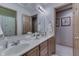 Bright bathroom with double sinks, spacious vanity, and neutral colored walls at 1344 S Fox Paw Dr, New Palestine, IN 46163