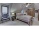 Comfortable bedroom with sloped ceiling, warm color palette, and a ceiling fan at 1344 S Fox Paw Dr, New Palestine, IN 46163