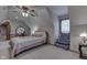 Cozy bedroom featuring an accent chair, carpeted floors, and neutral colored walls at 1344 S Fox Paw Dr, New Palestine, IN 46163