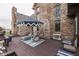 Outdoor deck with lounge chairs and an umbrella table at 1344 S Fox Paw Dr, New Palestine, IN 46163