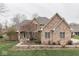 Stunning brick home featuring well-maintained landscaping and a welcoming entrance at 1344 S Fox Paw Dr, New Palestine, IN 46163