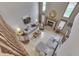 An elevated view of a cozy living room with a fireplace and stylish decor at 1344 S Fox Paw Dr, New Palestine, IN 46163