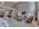 Spacious living area with comfortable seating, a piano, and elegant decor at 1344 S Fox Paw Dr, New Palestine, IN 46163