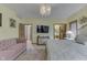 Comfortable main bedroom features plush carpeting, chandelier, and seating area at 1344 S Fox Paw Dr, New Palestine, IN 46163