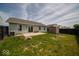 Backyard featuring a grass area, a shed, patio, and back of house at 1414 Dowell St, Greenwood, IN 46143