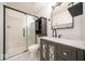 Bathroom with marble tiled walk-in shower and modern vanity at 1414 Dowell St, Greenwood, IN 46143