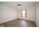 Bright bedroom with light gray wood-look flooring and natural light at 1414 Dowell St, Greenwood, IN 46143