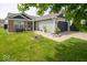 Charming single Gathering home with a well-manicured lawn, brick accents, and an attached two-car garage at 1414 Dowell St, Greenwood, IN 46143