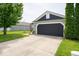 Charming single Gathering home with a well-manicured lawn, brick accents, and an attached two-car garage at 1414 Dowell St, Greenwood, IN 46143