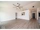 Bright living room with vaulted ceilings and light gray wood-look flooring at 1414 Dowell St, Greenwood, IN 46143