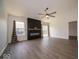 Living room featuring a modern fireplace and large windows for natural light at 1414 Dowell St, Greenwood, IN 46143