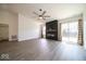 Living room featuring sliding glass doors to outside and a modern fireplace at 1414 Dowell St, Greenwood, IN 46143