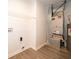 Functional utility room with washer/dryer hookups, extra storage, and easy-to-clean flooring at 1414 Dowell St, Greenwood, IN 46143