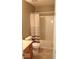 This bathroom features a shower/tub combo and neutral tiling at 14170 Royalwood Dr, Fishers, IN 46037