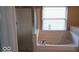 Bathroom featuring large tub and shower at 14170 Royalwood Dr, Fishers, IN 46037