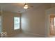 Bright bedroom with a ceiling fan and a view to the bathroom at 14170 Royalwood Dr, Fishers, IN 46037
