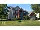 Beautiful two-story home with a well-maintained lawn and mature trees at 14170 Royalwood Dr, Fishers, IN 46037