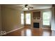 Cozy living room with a fireplace and hardwood floors at 14170 Royalwood Dr, Fishers, IN 46037