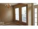 Neutral room with carpet, chandelier, and windows at 14170 Royalwood Dr, Fishers, IN 46037