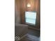 Staircase landing with window and light fixture at 14170 Royalwood Dr, Fishers, IN 46037