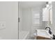 Clean and modern bathroom with white subway tile and updated fixtures at 1421 S New Jersey St, Indianapolis, IN 46225