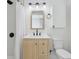 Bathroom features a light wood vanity with quartz countertop and modern fixtures at 1421 S New Jersey St, Indianapolis, IN 46225