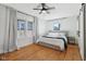 Bright bedroom with hardwood floors, natural light, and a cozy bed at 1421 S New Jersey St, Indianapolis, IN 46225