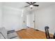 Spacious bedroom with hardwood floors and a comfortable gray sofa at 1421 S New Jersey St, Indianapolis, IN 46225