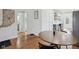 Open dining space connects to the kitchen and living room with hardwood floors at 1421 S New Jersey St, Indianapolis, IN 46225